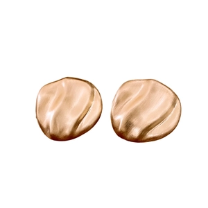 Irregular oval gold earrings with pleated wavy texture in minimalist brushed metal style