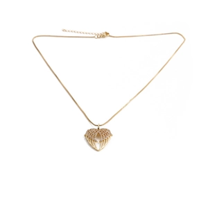 Detail of golden box chain and angel wing heart pendant with sparkling crystals