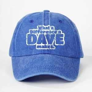 Macro detail of washed blue denim baseball cap showing white printed lettering and stitching