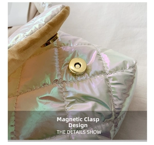 Detail of laser iridescent quilted down bag featuring a secure golden magnetic clasp