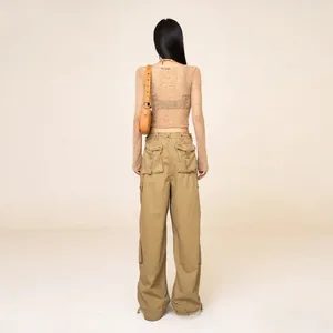 Rear view of retro cargo pants with oversized pockets and adjustable drawstrings