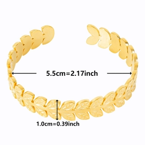 Detailed view of C-shaped gold stainless steel bracelet with leaf texture and sizing