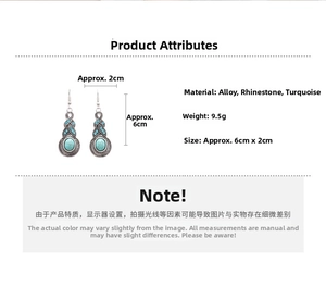 Detail view of vintage geometric leaf earrings with turquoise and rhinestone inlay