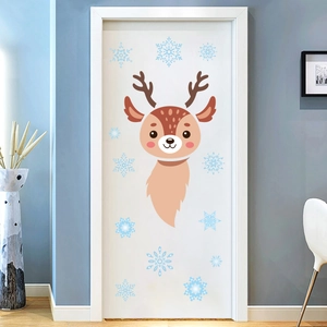 Cartoon reindeer and blue snowflake door stickers on a white door for Christmas party decor