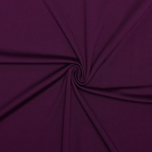 Detailed texture of dark purple ribbed knit fabric with soft folds and high elasticity
