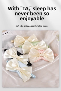 Detailed close-up of multi-colored silk sleep masks with large bow and elastic bands