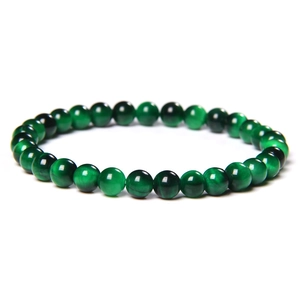 Close-up of 8mm green tiger eye stone beaded bracelet with cat eye optical effect