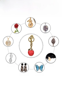 Detail showing red apple keychain with various jewelry processing craft techniques