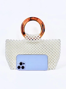 Handmade pearl beaded handbag with resin tortoise shell handles and size reference phone