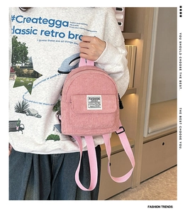 Pink corduroy mini backpack with Fashion Instinct label and canvas straps detail