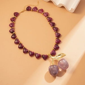 Acrylic heart beads and glitter cherry pendant necklace with gold branch in warm tones