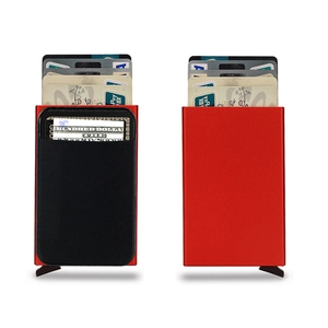 Detail of red aluminum RFID wallet showing pop-up card mechanism and cash pocket