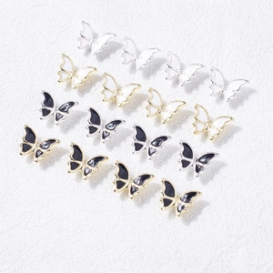 Bijoux d'ongles papillon 3D en émail noir et blanc avec montures dorées et argentées