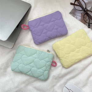 Quilted heart macaron-colored mini storage bags in purple, mint green, and light yellow