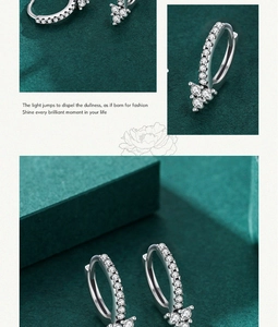 Detailed close-up of geometric S925 silver hoop earrings with micro-set zircon crystals