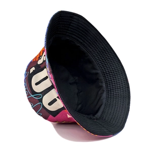 Reversible 90s vintage bucket hat featuring artistic graffiti print and solid black design
