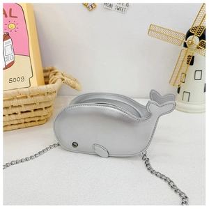 Detailed view of shiny silver dolphin crossbody bag with metallic chain strap for kids