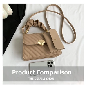 Detail of beige pleated handbag with heart clasp and matching small card pouch