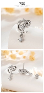 Detail view of silver star and moon stud earrings with sparkling cubic zirconia stones