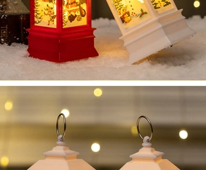 Detail of metal hanging loop and festive Santa illustration on LED Christmas lantern