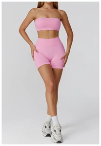 Detail shot of the pink seamless sports set showing knitted ribbed texture and fit