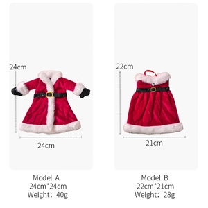 Detailed view of Christmas wine bottle covers in red velvet with size specifications