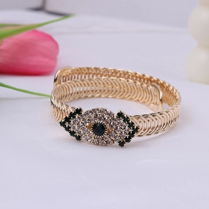 Vintage gold adjustable spiral bracelet with sparkling green and clear rhinestones