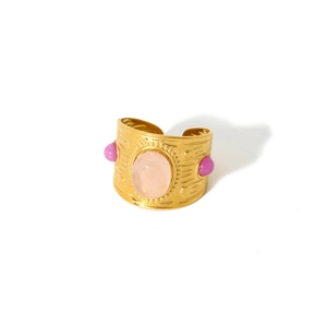 Detail of 18k gold plated stainless steel ring with pink oval stone and purple gems
