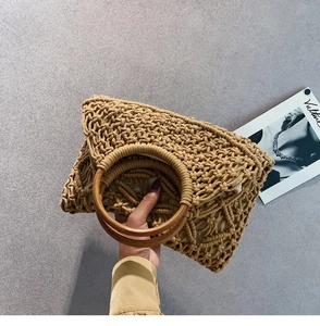 Detail of wheat-ear braided cotton cord pattern and dark brown round wooden handle