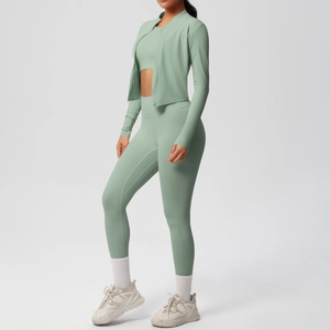 Three-piece sage green yoga set with high waist leggings and long sleeve zip jacket