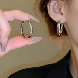 Minimalist silver geometric hoop earrings for women with high-polish metallic finish