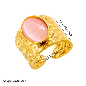 Vintage gold plated stainless steel wide ring with oval pink gemstone and hammered texture