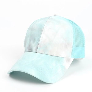 Detail of blue and white tie-dye fabric and breathable mesh on ponytail baseball cap