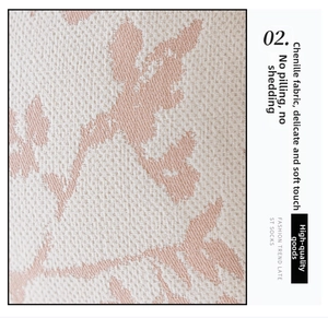 Detailed macro view of soft beige chenille fabric with delicate pink floral patterns
