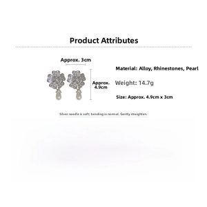 Detailed view of flower earrings with rhinestones, drop pearl accents, and size dimensions