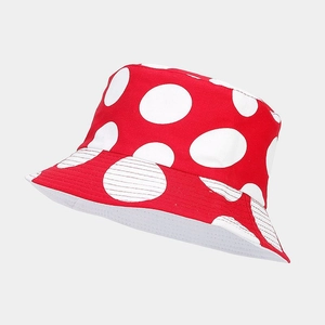 Detailed close-up of a red and white mushroom pattern bucket hat made of durable canvas