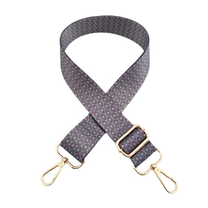 Ethnic style woven shoulder strap with geometric patterns and gold metal clasps