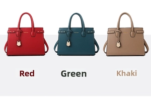 Detail view of stylish tote bags set in red, green and khaki with textured leather