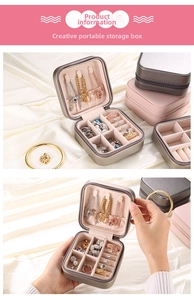 Detail view of portable jewelry organizer showing ring slots and necklace hooks