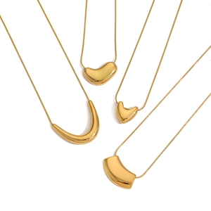 Minimalist gold U-shaped necklaces with diverse pendants on a clean white backdrop