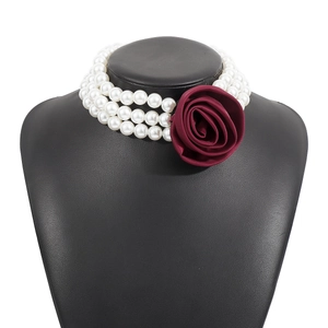 Vintage three-layer pearl choker necklace with a burgundy satin rose accent