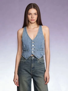 Detail of slim fit light blue denim vest with V-neckline and five-button closure