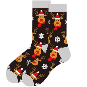Close-up of black Christmas socks featuring brown reindeer and white snowflakes patterns