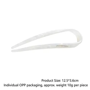 Minimalist U-shaped acetate hair pin with white marble texture on white background