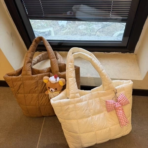Quilted tote bags in brown and beige colors with a soft padded finish for daily use