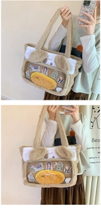 Detail of plush tote bag with transparent PVC window and cute 3D ears design