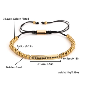 Detail of adjustable beaded bracelet with gold plating and black micro-inlaid stones