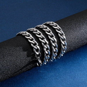 Polished silver stainless steel cuban link chain necklace with lobster clasp on display
