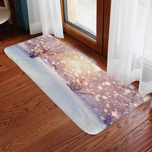 Detail showing the soft flannel texture and winter snow landscape pattern on the rectangular mat