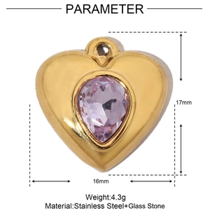 Macro detail of a 17mm gold stainless steel heart pendant with purple gemstone